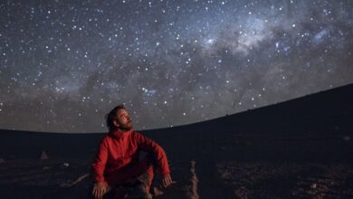 man looking up at the stars