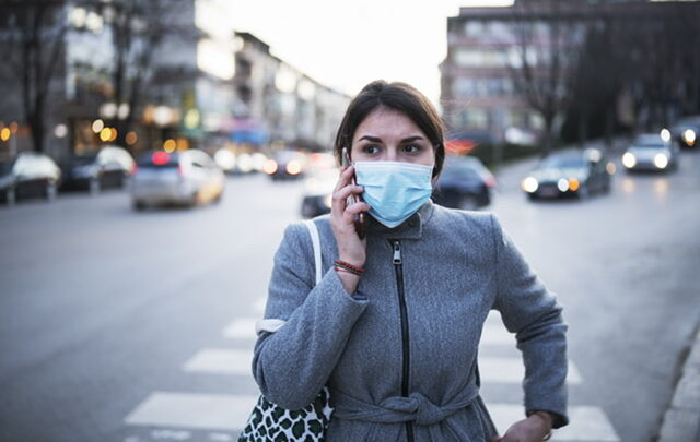 Woman wearing Face mask in city